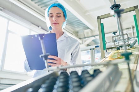 Young Woman Working at Factoryの写真素材