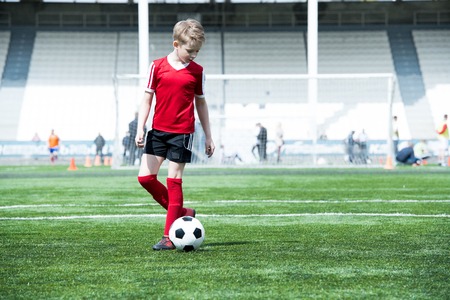 Teenage Boy in Football Fieldの写真素材