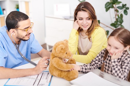 Pediatrician Examining Teddy Bearの写真素材