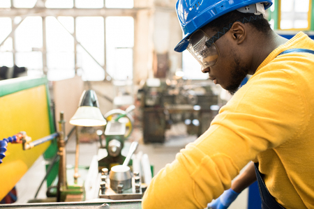 Concentrated African engineer at workの写真素材