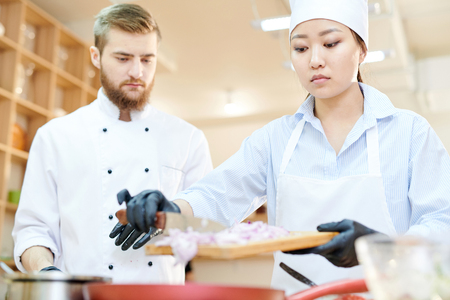Two Chefs Working in Cafe Kitchenの写真素材