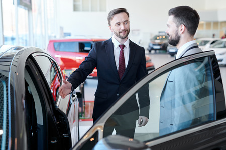 Businessman Buying New Carの写真素材