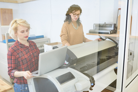 Printer operators working in officeの写真素材