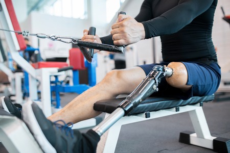 Adaptive Athlete Using Rowing Machine Closeupの写真素材