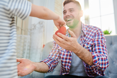 Son Giving Present to Dadの写真素材