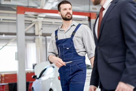 Mechanic Giving Tour of Car Factoryの写真素材