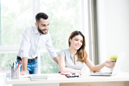 Two Modern Business People in Officeの写真素材
