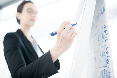 Businesswoman Giving Presentation at Whiteboardの写真素材