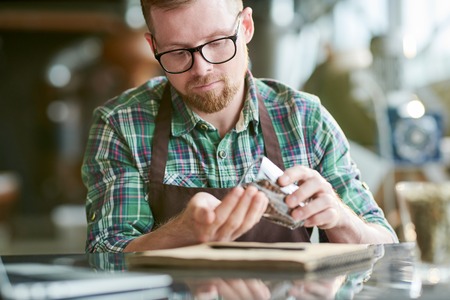 Modern Barista Examining Coffee Beans