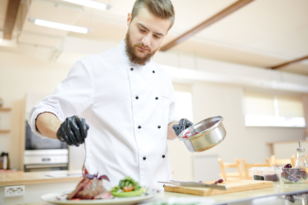 Chef Plating Meat Dishの写真素材