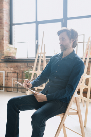 Mature Artist Sketching in Studioの写真素材