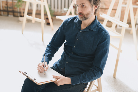 Talented Artist Drawing Sketches in Studioの写真素材