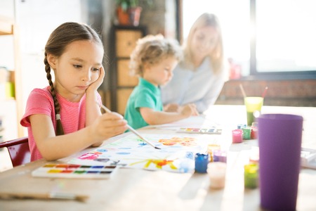Little girl painting
