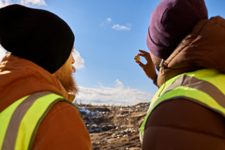 Miners Inspecting Minerals Back Viewの写真素材