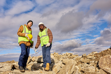 Miners Inspecting Excavation Siteの写真素材