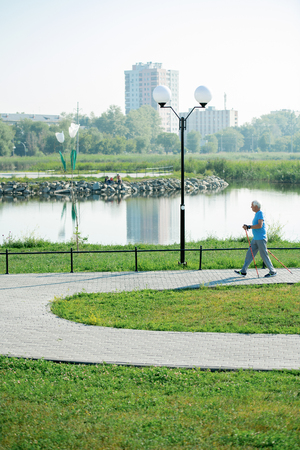 Active Pensioner Practicing Nordic Walkingの写真素材