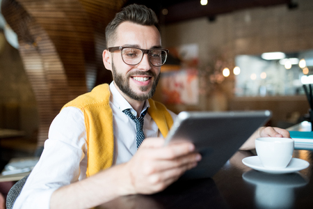 Smiling Businessman Using Tabletの写真素材
