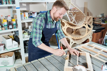 Carpenter painting woodの写真素材