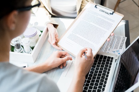 Female Client Signing Contractの写真素材