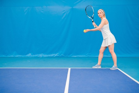 Blonde Woman Playing Tennisの写真素材
