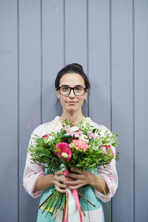 Florist Posing by Wallの写真素材