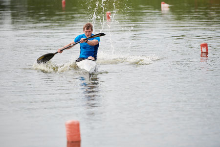 Kayaker rowing on the riverの写真素材