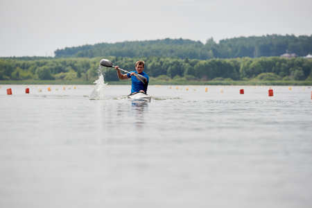 Kayker paddling on the lakeの写真素材