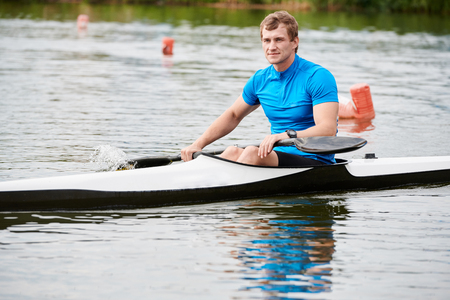 Man floating on kayakの写真素材