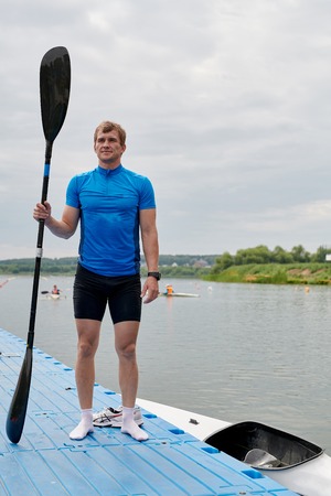 Young kayaker on the lakeの写真素材