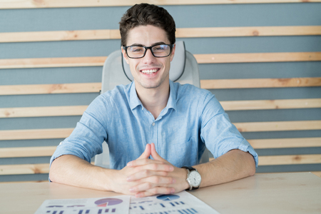 Young businessman sitting at officeの写真素材