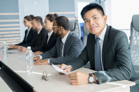 Businessman sitting at seminarの写真素材