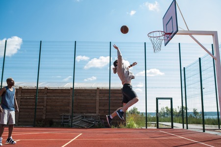 Basketball Player Shooting Slam Dunkの写真素材