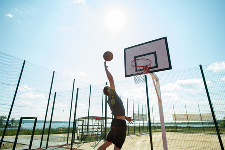 Young Man Shooting Slam Dunkの写真素材