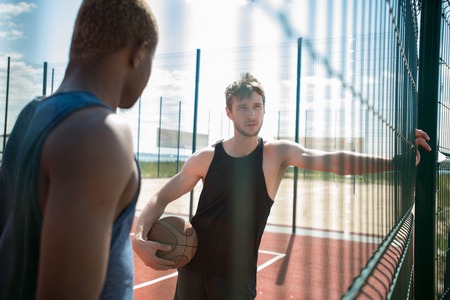 Man Resting in Basketball Courtの写真素材