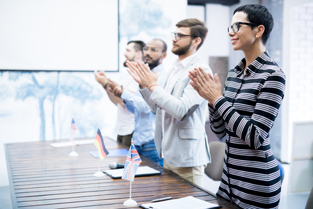 Applauding speaker at conferenceの写真素材