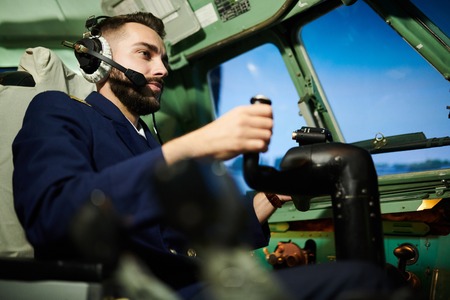 Pilot in Airplane Cabin