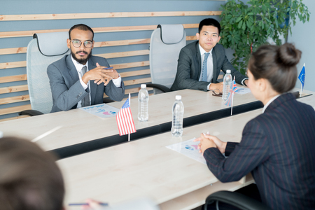 Multi-ethnic diplomats leading negotiationsの写真素材