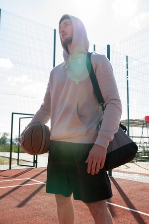 Young Man in Outdoor  Basketball Courtの写真素材