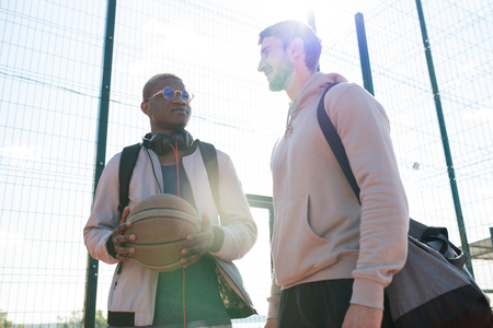 Two Young Men in Outdoor  Basketball Courtの写真素材
