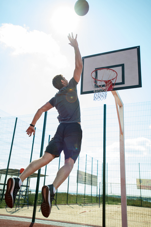 Young Man Shooting Slam Dunkの写真素材