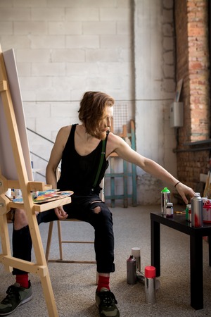 Handsome Artist Working by Easelの写真素材