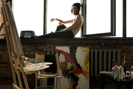 Contemporary Artist Posing on Windowの写真素材