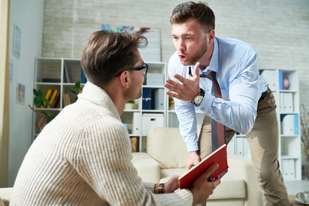 Patient screaming at psychiatristの写真素材