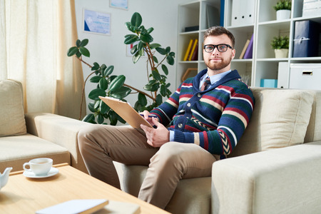 Confident young psychiatrist in own officeの写真素材