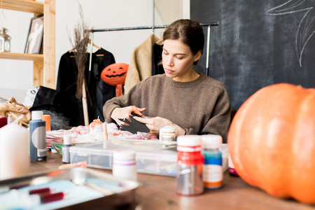 Halloween designer making decoration in studioの写真素材