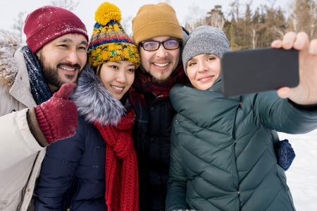 Four Friends Posing for Selfieの写真素材