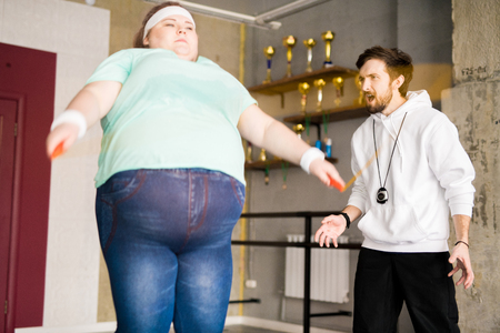 Angry Coach Training Fat Womanの写真素材