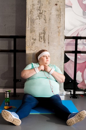 Obese Woman Relaxing in Fitness Clubの写真素材