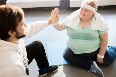 Fat Woman High Five with Coachの写真素材