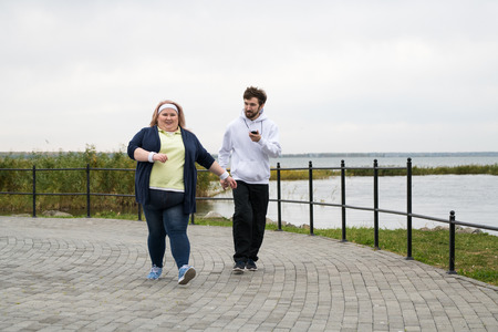 Obese Woman Jogging Outdoorsの写真素材